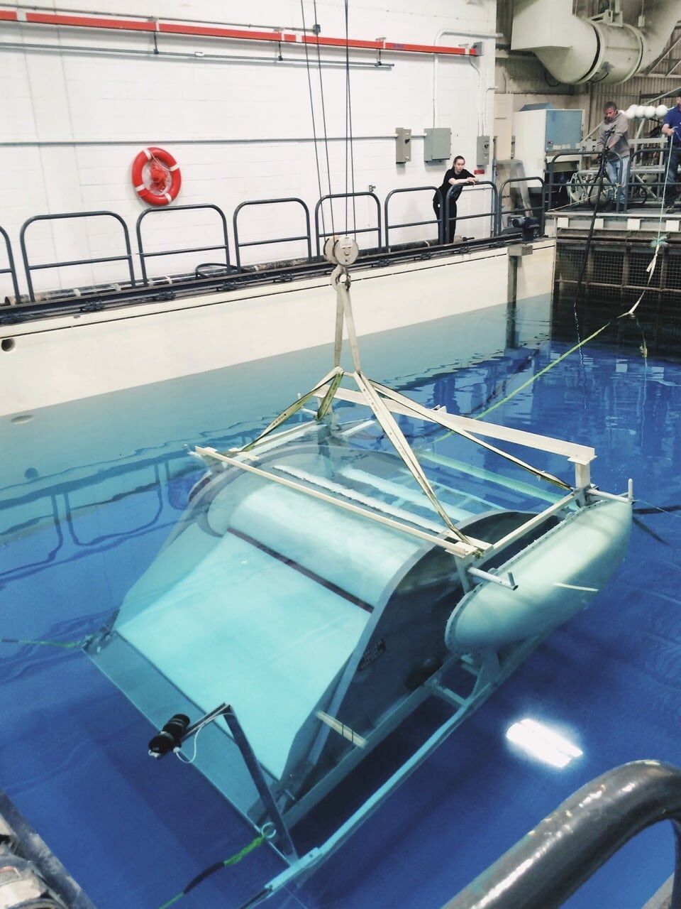 Waterotor on a test frame in a bright blue flume tank