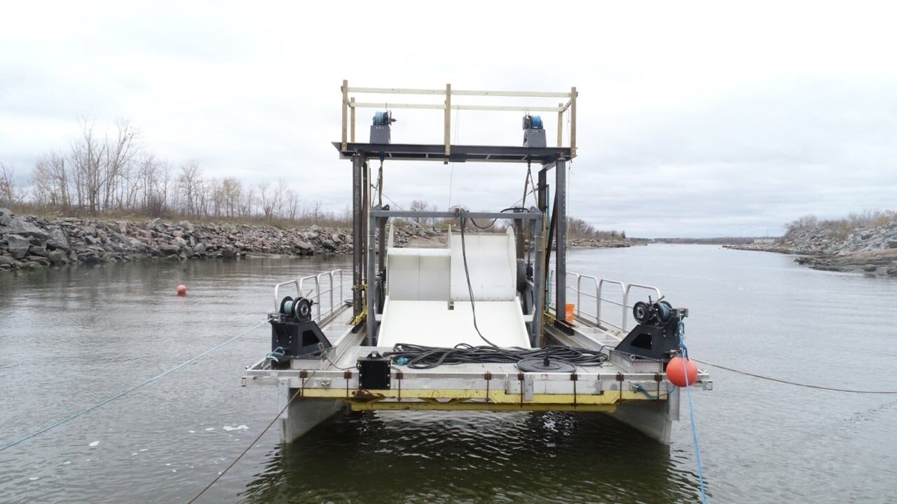 Waterotor mounted on a floating barge anchored in a river